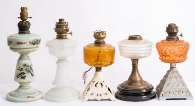 Five various Edwardian plain, coloured and opaque glass oil lamp bases, of various designs.