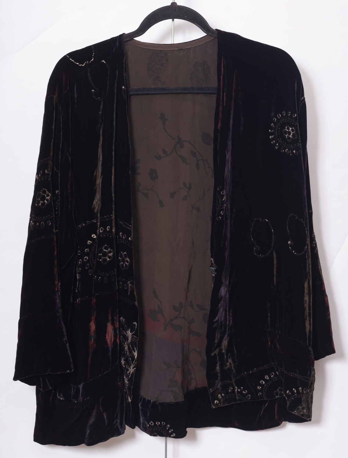 A collection of various textiles, including a black velvet jacket, whiteware etc.