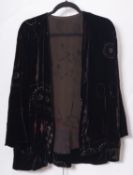 A collection of various textiles, including a black velvet jacket, whiteware etc.