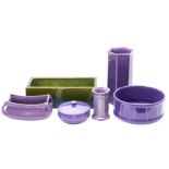 A Bretby green glazed flower trough, together with a small group of purple glazed earthenwares.