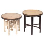 Three near eastern repousse work brass circular tiffin tables on stained or painted wood stands,