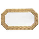 A Victorian repousse brass framed octagonal wall mirror,