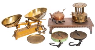 A set of iron and brass mounted countertop scales, early 20th century; 23cm high,