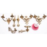 A pair of cast brass twin light applique with foliate scroll decoration, 31cm across,