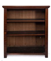 An Edwardian low oak open bookcase, fitted with adjustable shelves,