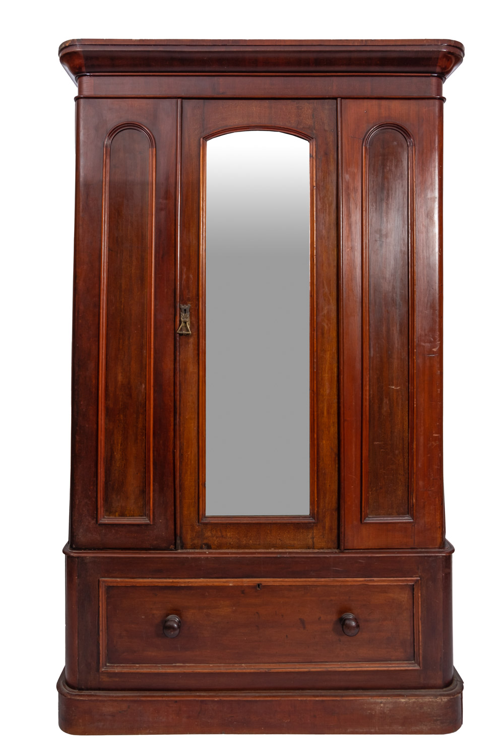 A Victorian mahogany wardrobe with a moulded cornice enclosed by a central mirror panel,