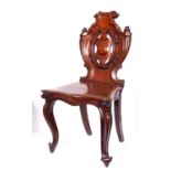 A Victorian carved mahogany hall chair,