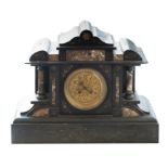 A Victorian black marble serpentine striking mantel clock, circa 1880.