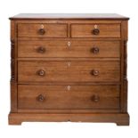 An early 19th Century oak rectangular chest containing two short and three long drawers between