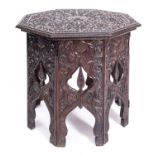 An Anglo Indian carved hardwood octagonal occasional table on integral stand,