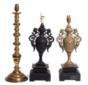 Two similar metal neoclassical twin handled urn lamps, one gilded,