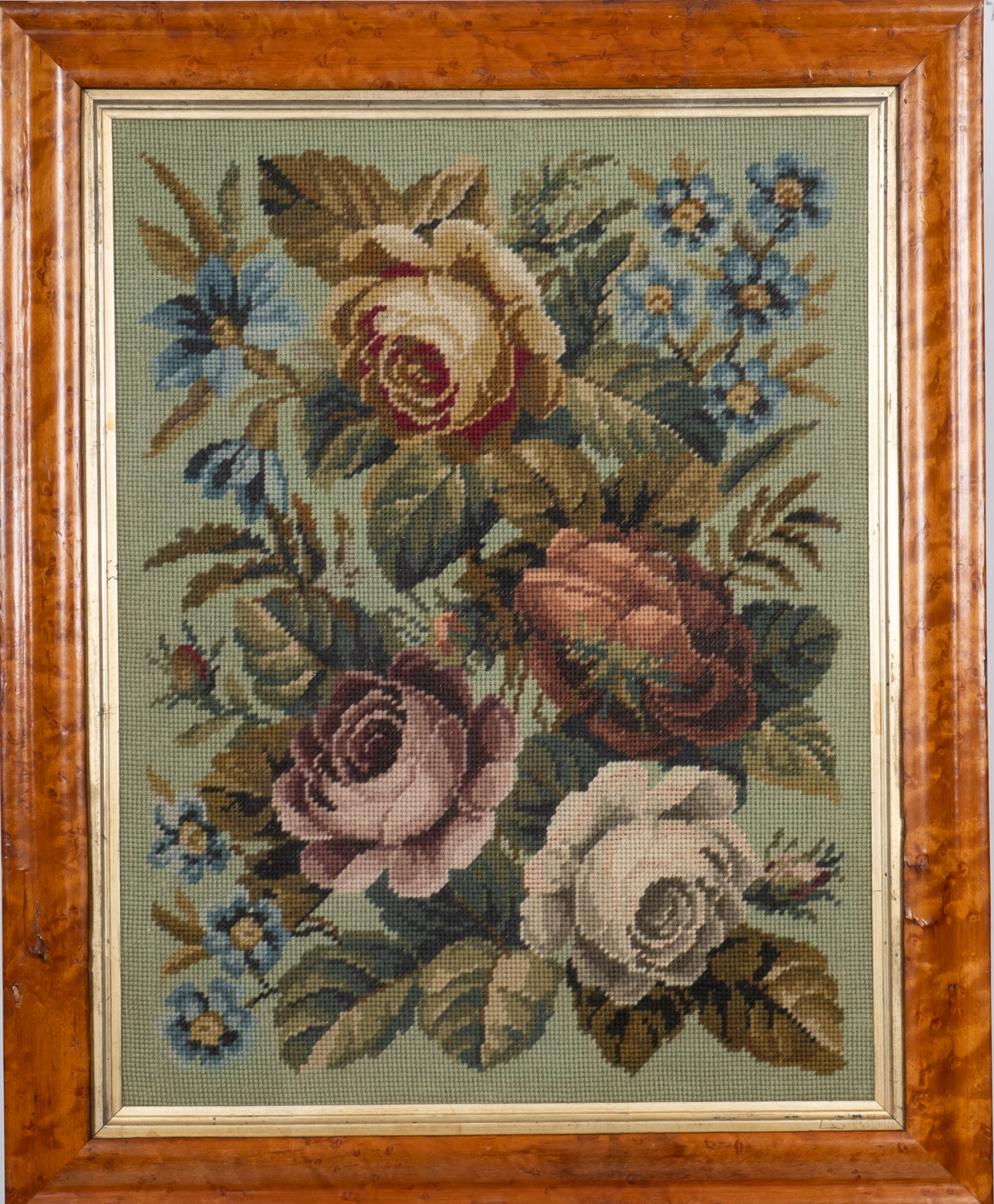 A Victorian gros point needlework picture, depicting a bouquet of floral foliage,
