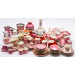 A collection of 19th century and later tea wares, predominately in pink and orange glazes.