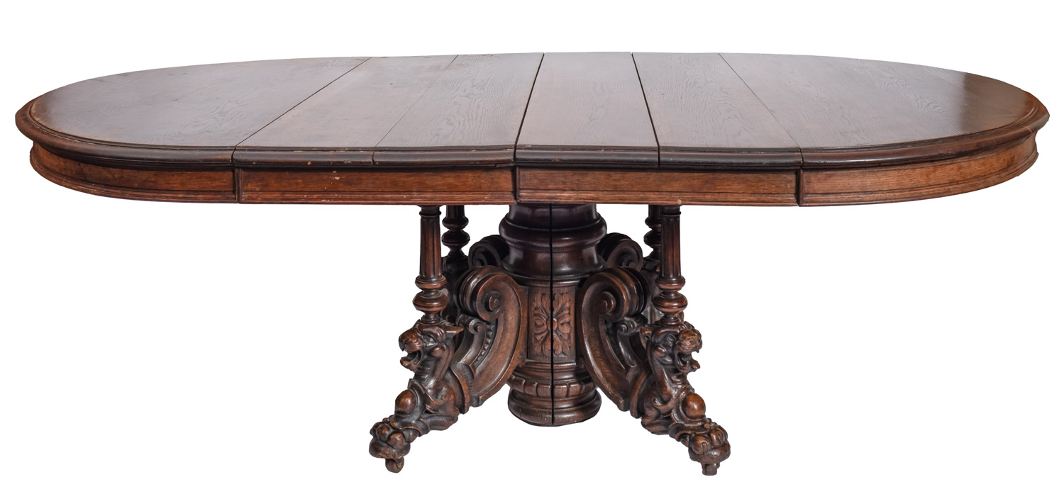 A Victorian oak D-end extending dining table, circa 1880, the top with a molded edge,