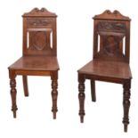 A pair of 19th Century walnut hall chairs, circa 1890,