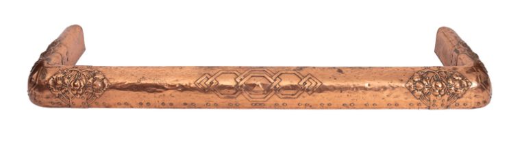 An Arts and Crafts copper rectangular fire kerb, circa 1900, with stylised decoration,