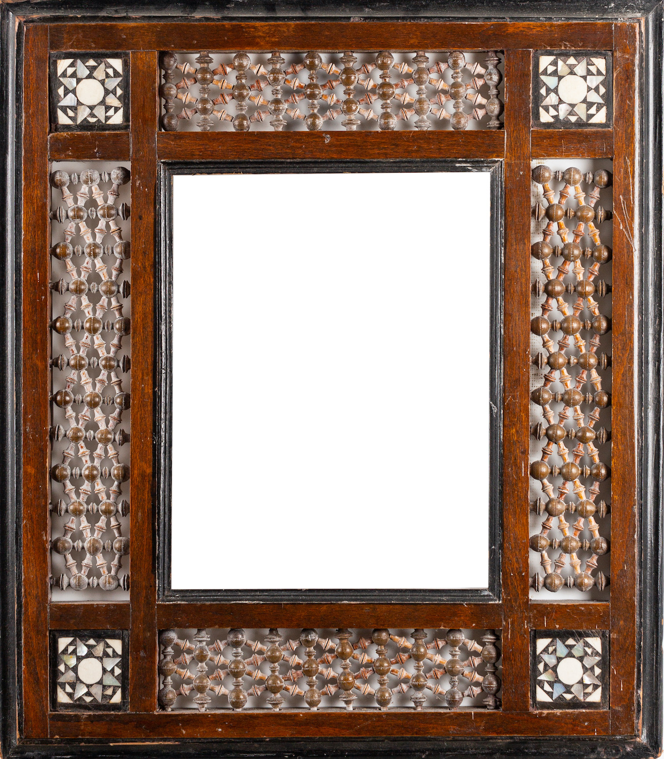 An Arts and Crafts Moorish frame with Mashrabiya turnings and bone inlay. 47 x 41cm, 27 x 20. - Image 2 of 2