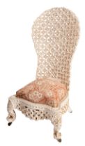 An Anglo Indian carved hardwood low chair, late 19th Century and later painted white overall,