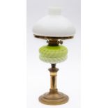 An Edwardian glass oil lamp with opaque glass shade,