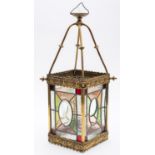 A late Victorian brass and leaded stained glass hall lantern,