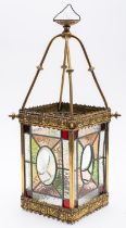 A late Victorian brass and leaded stained glass hall lantern,