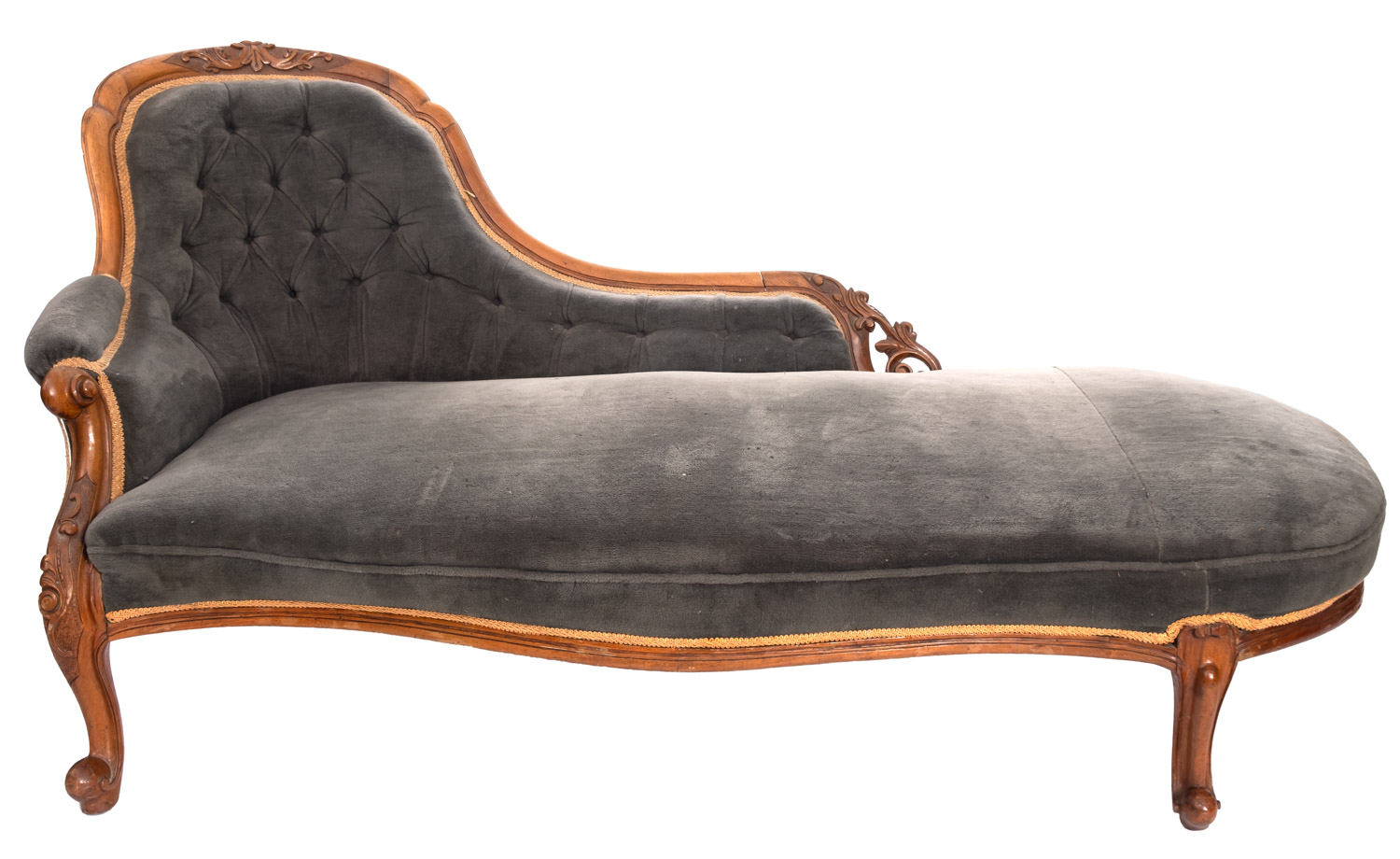 A Victorian carved walnut and upholstered chaise longue, circa 1870,