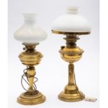 A late Victorian brass oil lamp with white opaque glass shade,