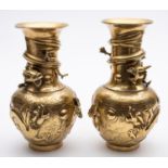 A pair of Chinese brass vases with raised decoration of dragons,