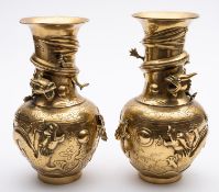 A pair of Chinese brass vases with raised decoration of dragons,