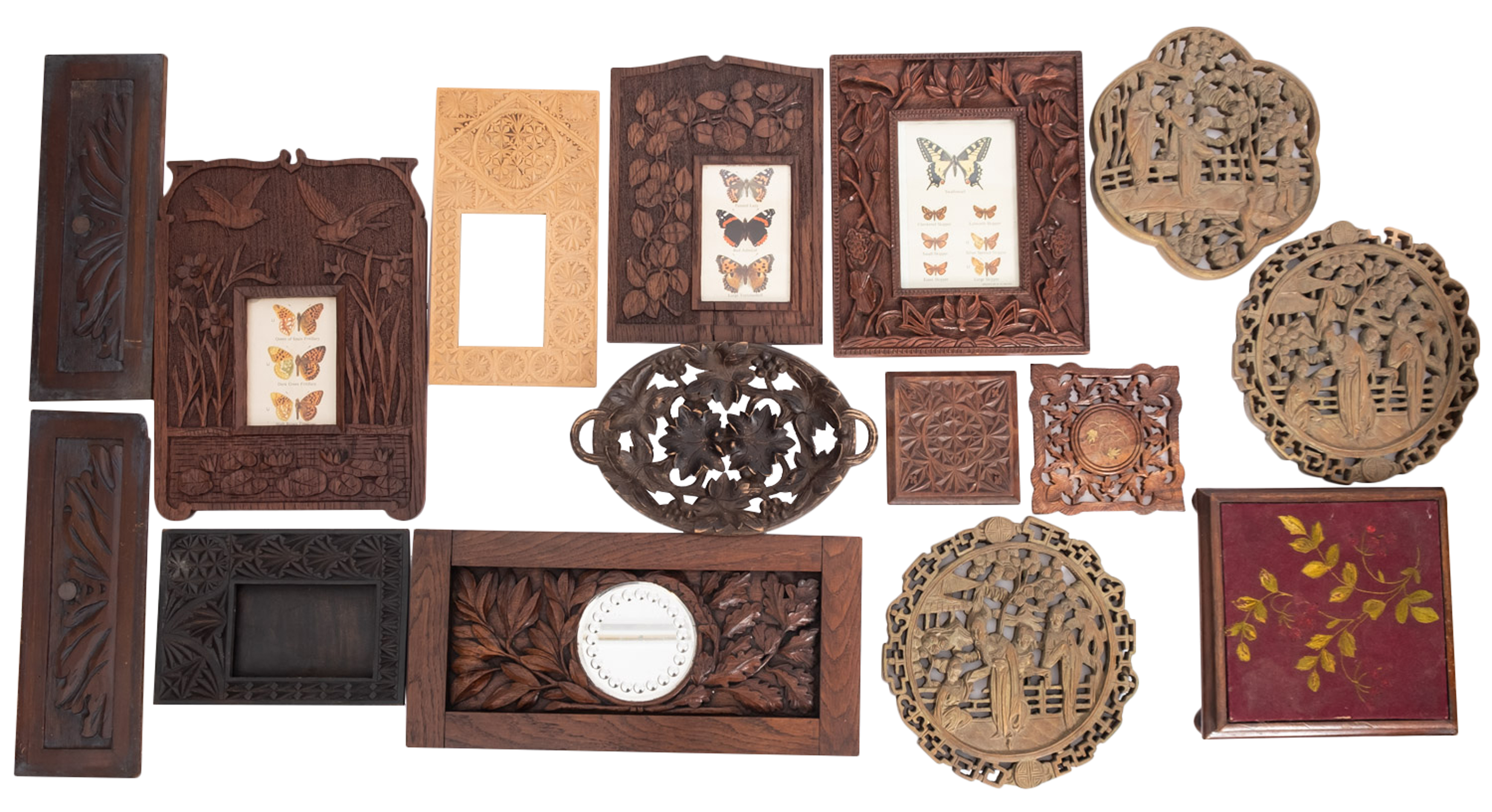 A collection of assorted relief carved wood items,