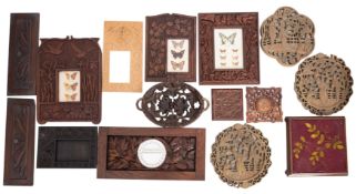 A collection of assorted relief carved wood items,