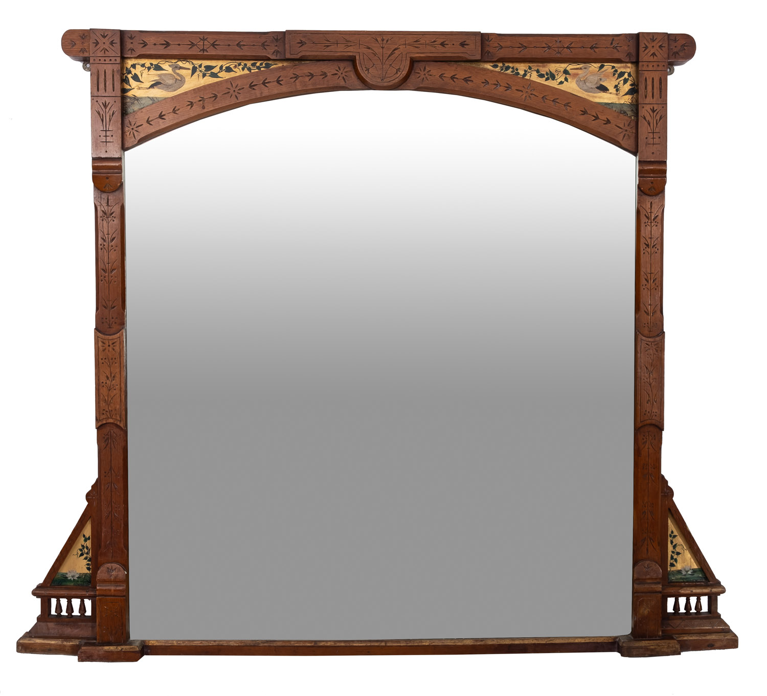 A late Victorian oak and decorated overmantel mirror in the Aesthetic Movement taste with incised
