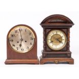 A late Victorian walnut cased fourteen day striking mantel clock,