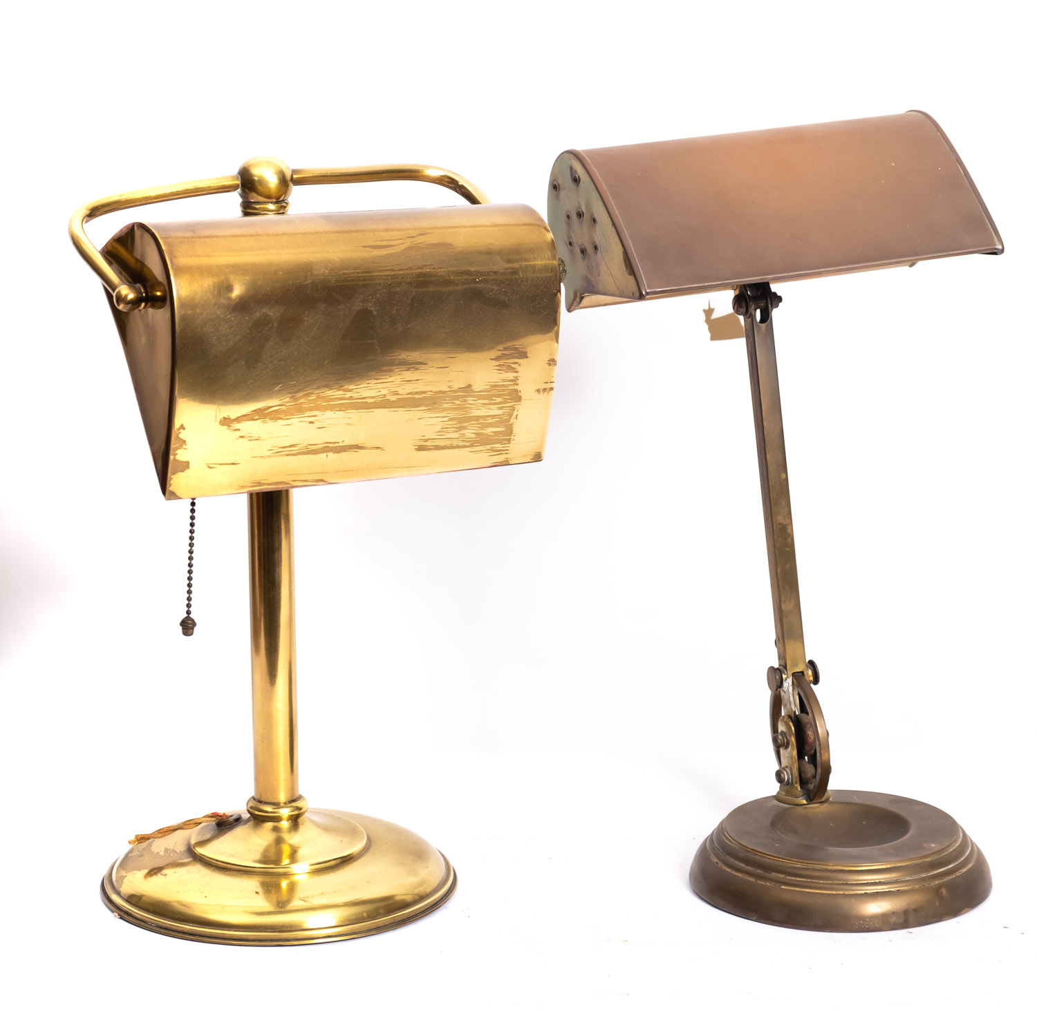 Two adjustable brass desk lamps, early 20th century; both with rectangular domed shades,