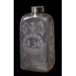 A 19th century Dutch white metal topped copper wheel engraved spirit bottle.