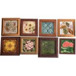 A collection of eight Staffordshire pottery glazed tiles with floral foliate decoration,