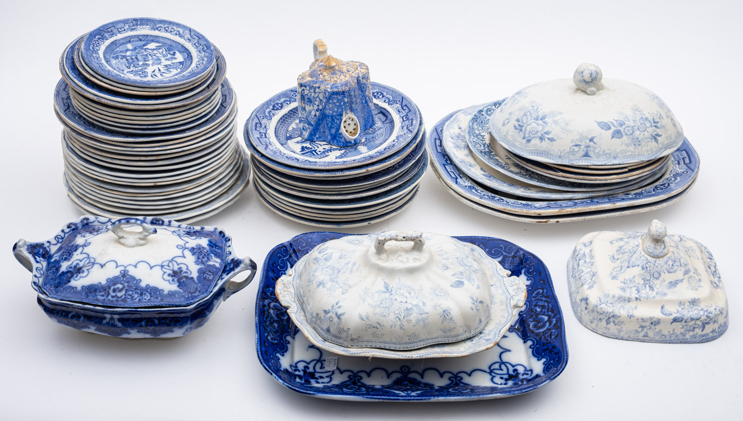 A quantity of various blue and white tablewares including oval meat dishes, tureens etc.