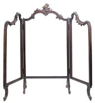 A 19th century French ebonised three-fold screen with floral carved show frame raised on scroll