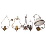 A collection of five late Victorian/ Edwardian hanging oil lamps,