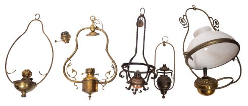 A collection of five late Victorian/ Edwardian hanging oil lamps,