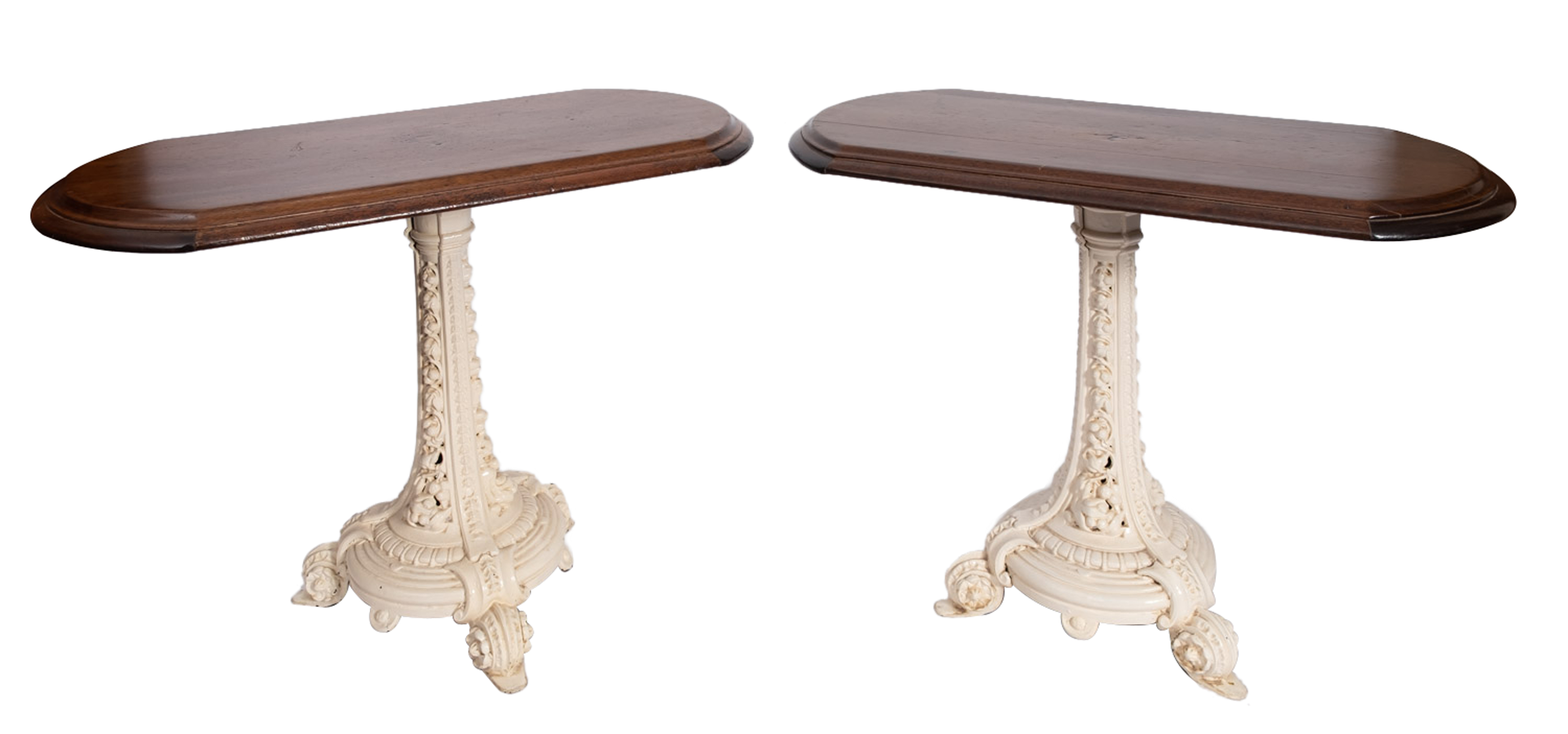 A pair of Victorian cast iron and later stained oak topped conservatory tables, late 19th Century,