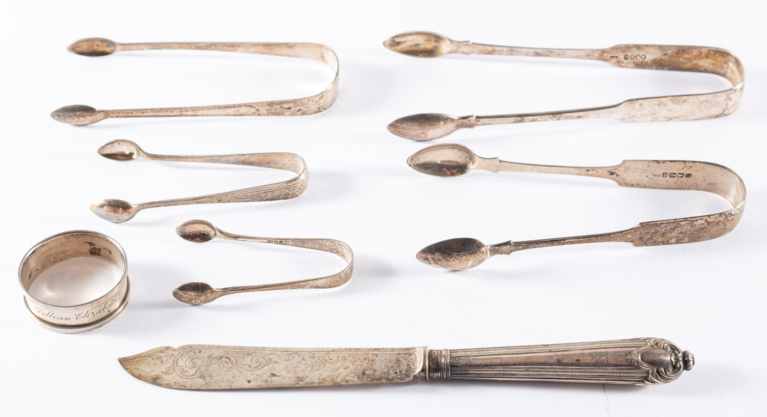 Two pairs of Irish silver, fiddle-pattern sugar tongs, Dublin 1824 and 1832,