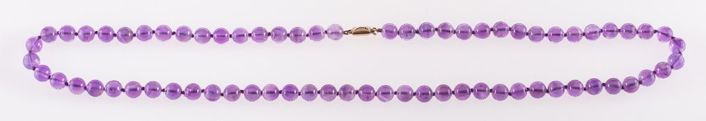 An Amethyst bead necklace, circular 8mm