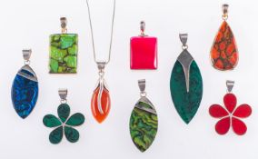 A group of nine various colourful shaped