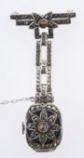 An Art Deco silver watch brooch, of orna