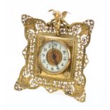 A brass mounted mantel clock having a French eight-day duration timepiece movement with a platform