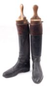 Maxwell of London. A pair of black and tan leather riding boots with trees, 30cm heel to toe.