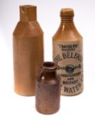 A collection of ten stoneware ginger beer printed bottles including Stroud, Middlesborogh,