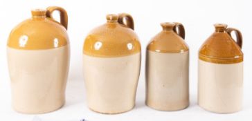 Four honey glaze stoneware storage bottles, one stamped 'E. Parfitt & Co.
