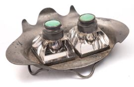 An Arts and Crafts pewter and glass two bottle inkwell by Connell, 83 Cheapside,